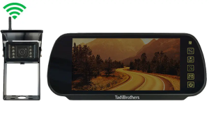 Digital wireless RV backup mirror monitor mounted inside a motorhome displaying rear camera footage for safer reversing, lane changes, and towing visibility on the road