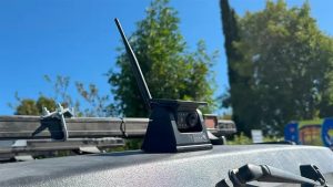 Wireless roof-mounted backup camera on work vehicle